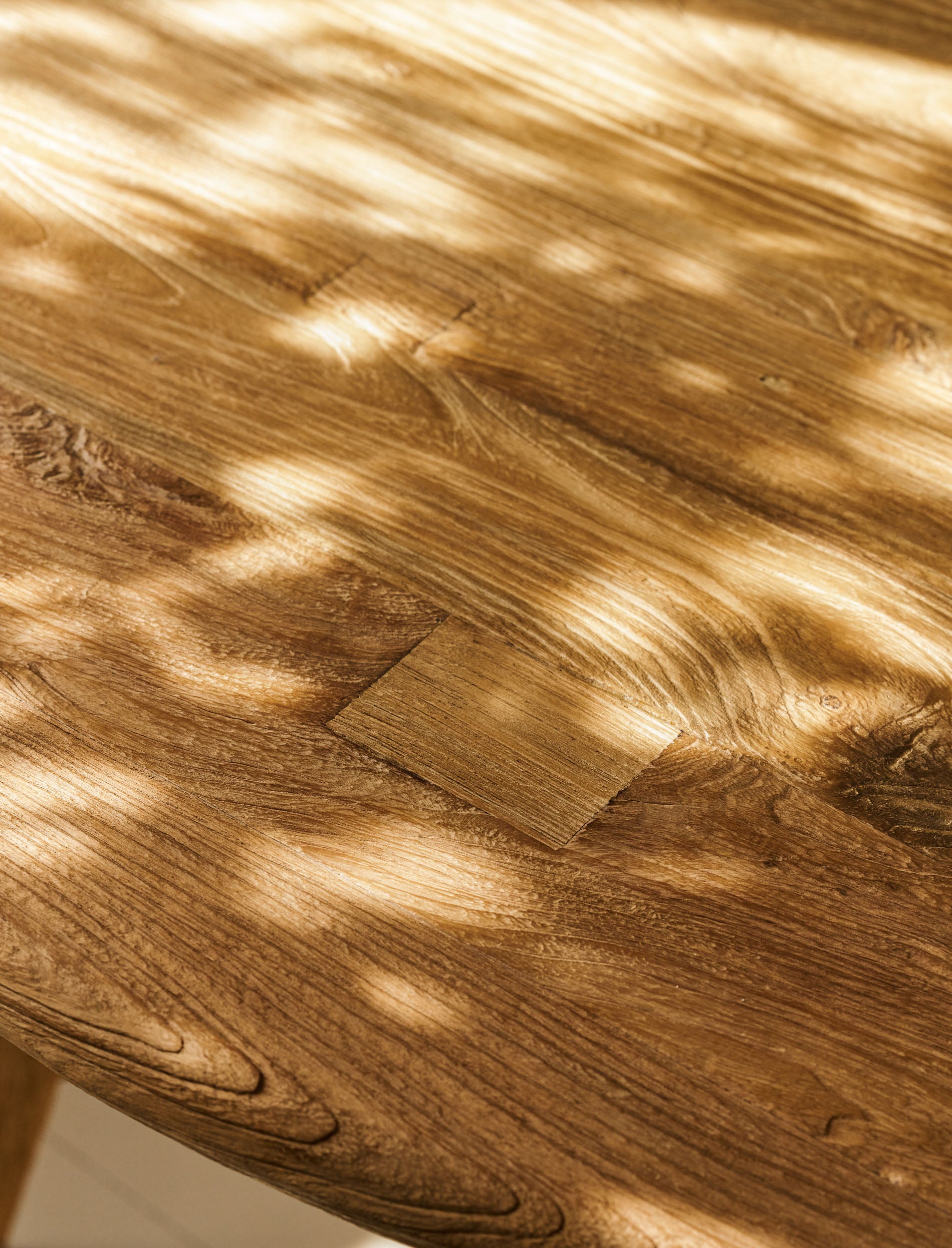 Close-up of a wooden surface with natural grain and texture of wooden dining table