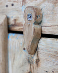 Close up of locks on natural wood rustic cabinet.