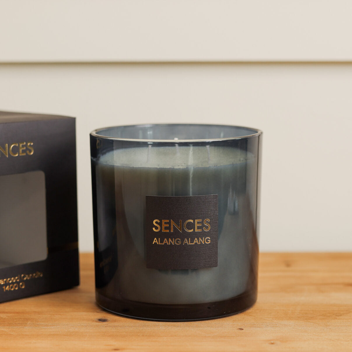 Sences Alang Alang Onyx Candle on wooden console.