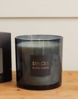 Sences Alang Alang Onyx Candle on wooden console.