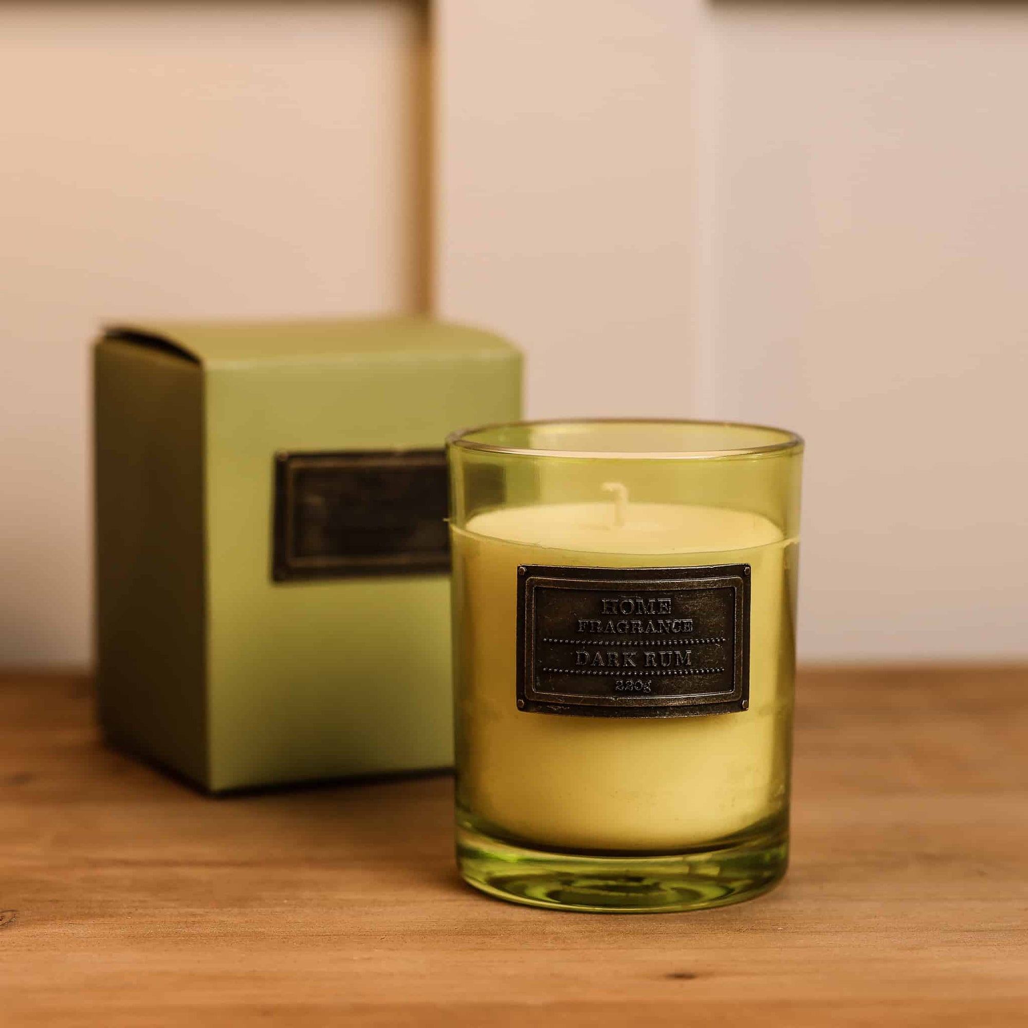 Dark Rum and Lime Candle with presentation box on wooden console.