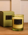 Dark Rum and Lime Candle with presentation box on wooden console.