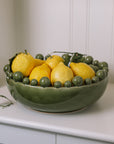 ceramic green bobble bowl with lemons.
