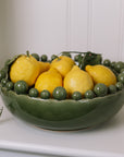 ceramic green bobble bowl with lemons.