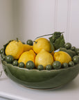 ceramic green bobble bowl with lemons.