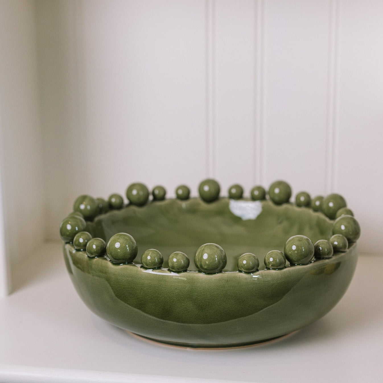 ceramic green bobble bowl with lemons.
