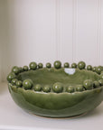 ceramic green bobble bowl with lemons.