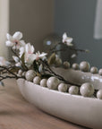 Cream oval bobble bowl with magnolia flowers.