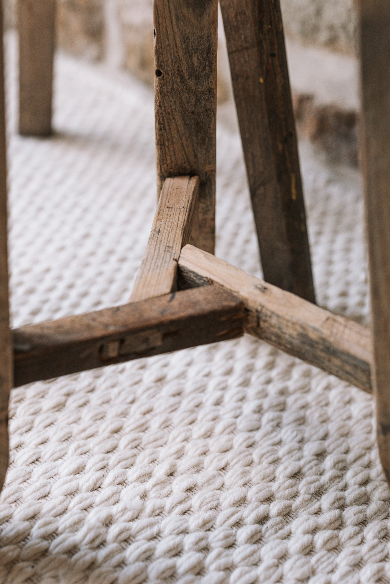 Pair of reclaimed wooden stools with book and cup of tea.