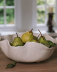 Wavy Ceramic Bowl filled with pears and leaves.