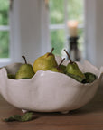 Wavy Ceramic Bowl filled with pears and leaves.