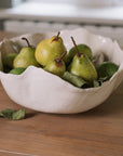 Wavy Ceramic Bowl filled with pears and leaves.