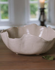 Wavy Ceramic Bowl filled with pears and leaves.