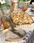 Glass and wicker tray on spring table.