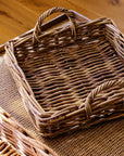 Natural woven trays on a wooden surface