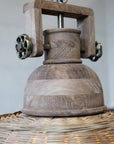Close up of wooden neck on rattan pendant light.