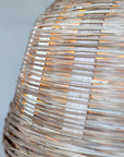 Close up of rattan pendant light wicker shade.