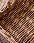 Close-up of natural woven trays with a focus on the texture and pattern of the wicker.