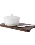 Stoneware Cheese Baker Set on wooden paddle.
