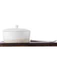 Stoneware Cheese Baker Set on wooden paddle.