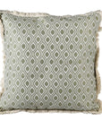 Green cushion cover with ogee pattern and fringed edge.