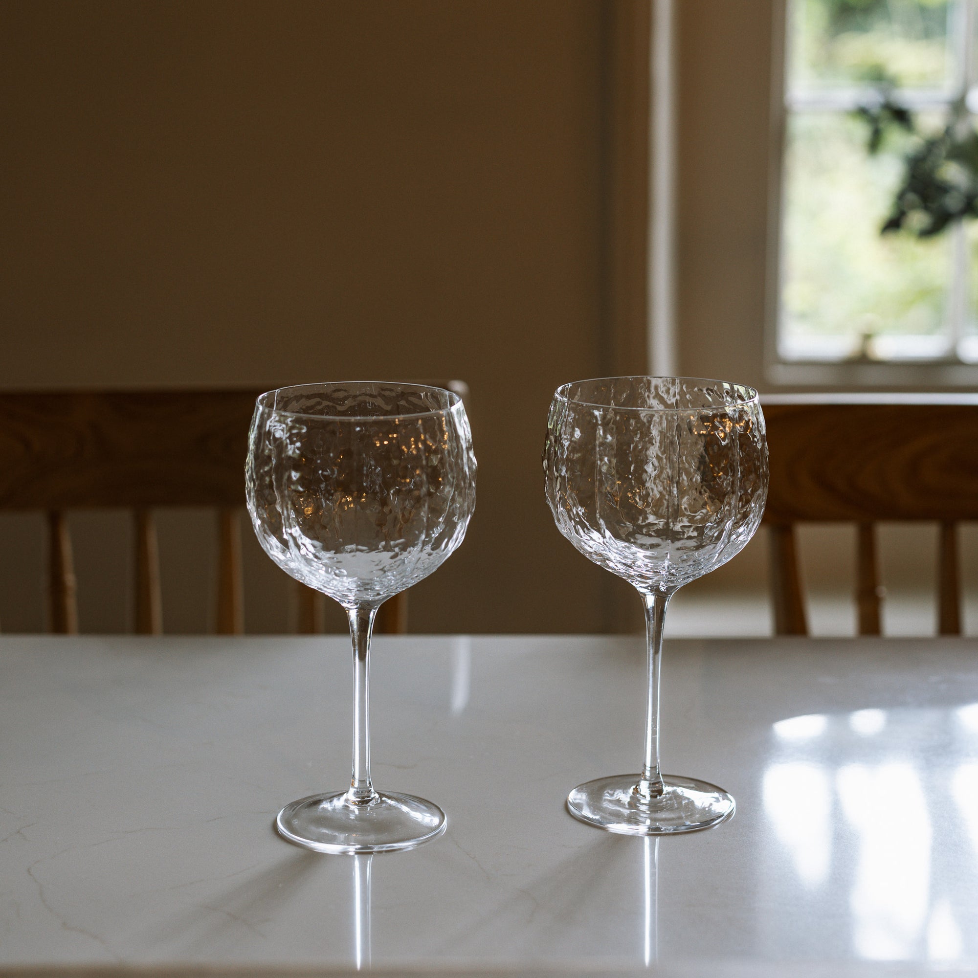 Set of four textured red wine glasses