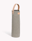Striped wine bottle bag with a leather strap on a white background