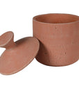 Large terracotta decorative jar with lid off.