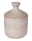Taupe storage jar with lid on.