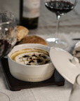 Cheese Baker set with cheese, chilli and wine on linen tablecloth.