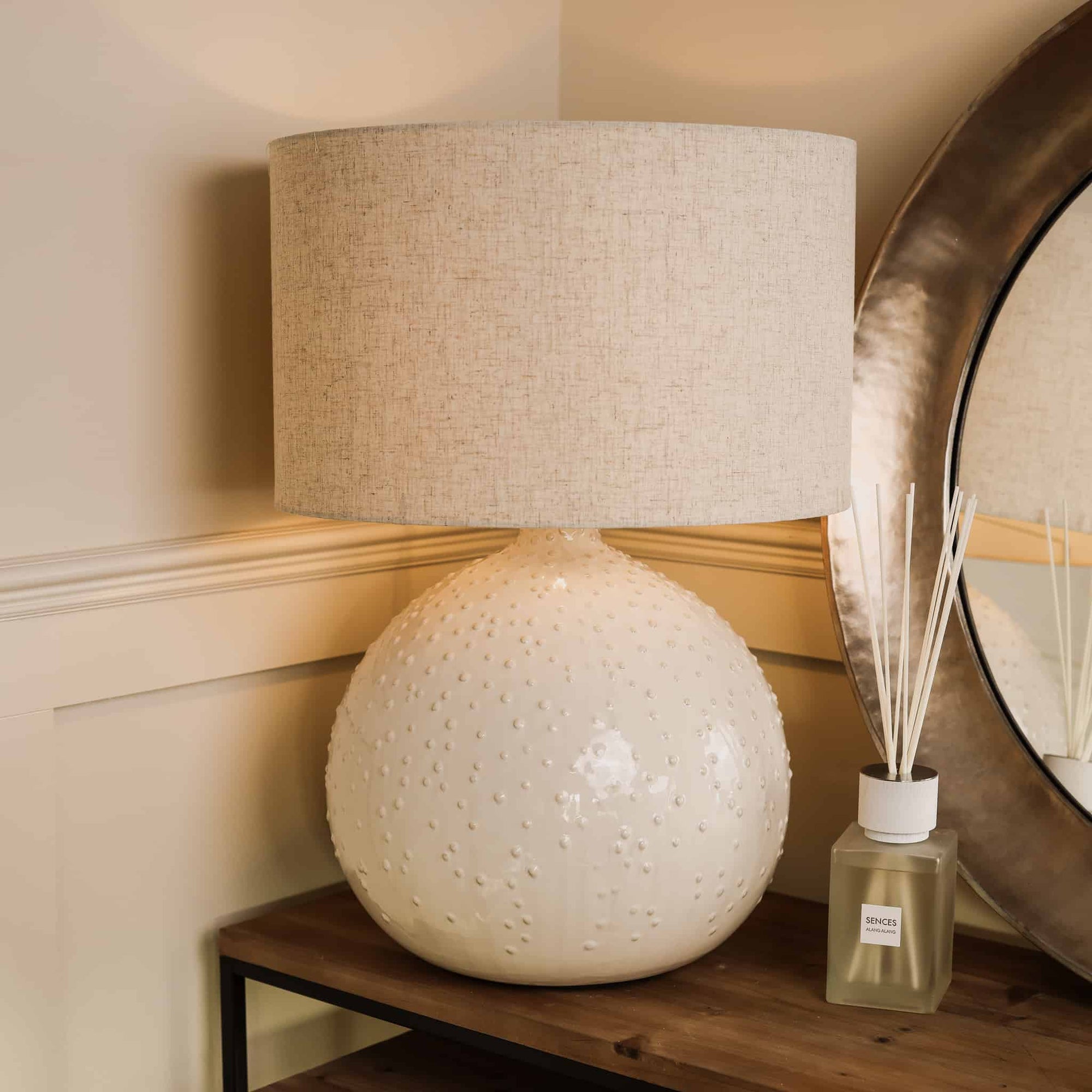 White textured ceramic table lamp with a clear diffuser.