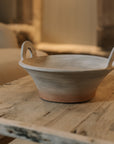 Eli Terracotta Decorative Bowl on wooden coffee table.