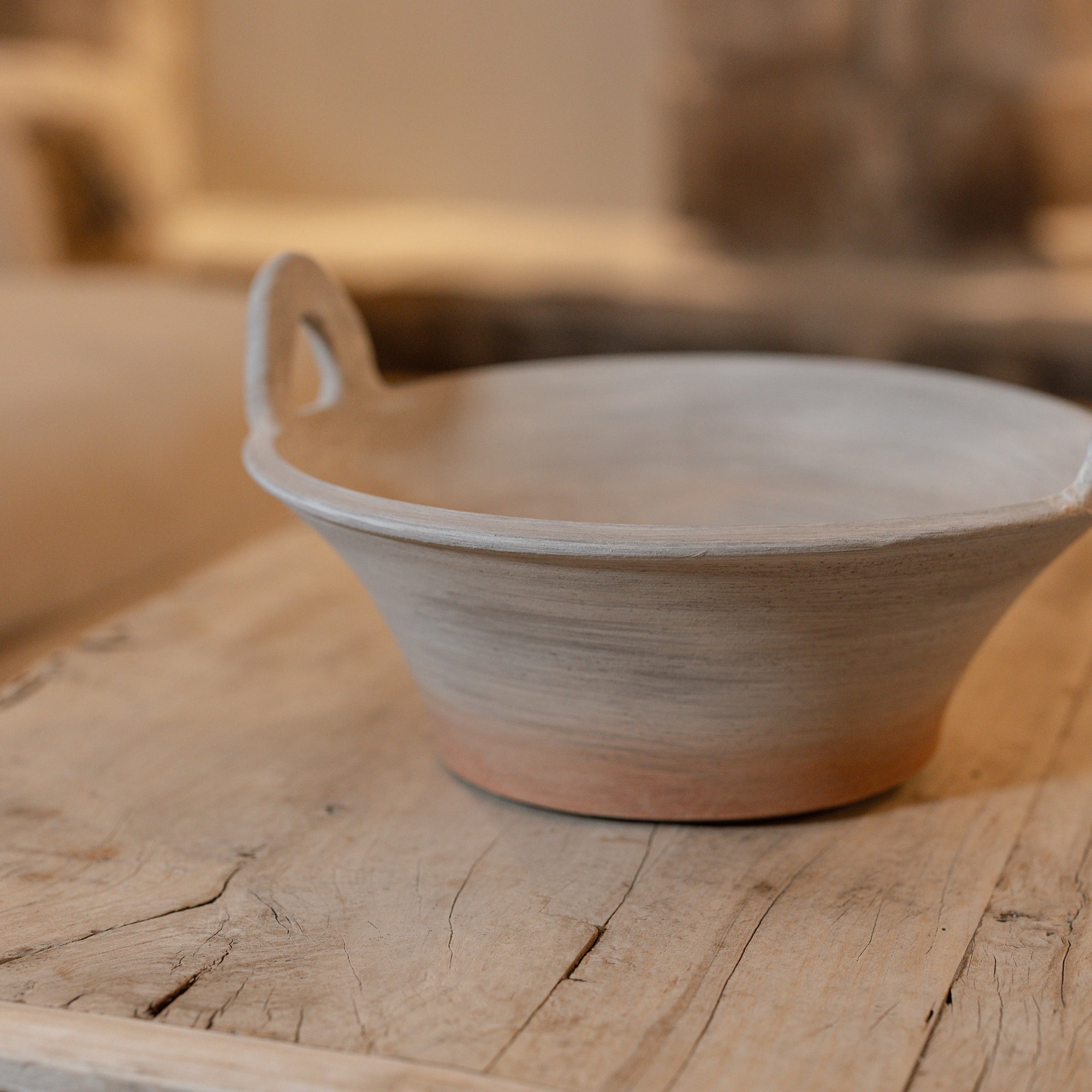 Eli Terracotta Decorative Bowl on wooden table.