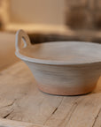 Eli Terracotta Decorative Bowl on wooden table.
