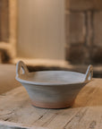 Eli Terracotta Decorative Bowl on wooden table.