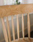 Farmhouse Bar Stools With Backs in dark wood kitchen.
