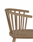 Vintage inspired wooden carver chair with curved back and spindles.