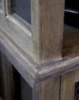 Close up of natural grain on wood display cabinet.