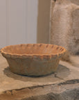 Large Terracotta Planter with a Pie Crust Rim on stone step.