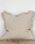 Light brown striped cushion with ruffled frayed edge.