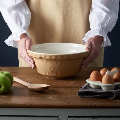 Mason Cash mixing bowl in neutral cane colour on chopping block.