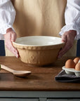 Mason Cash mixing bowl in neutral cane colour on chopping block.