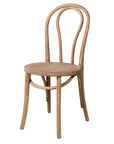 White washed oak dining chair with curved, rounded back.
