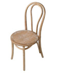 White washed oak dining chair with curved, rounded back.