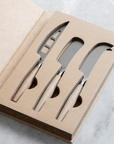 Wood cheese knife set in package.