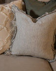 Pinstripe black and white linen cushion with frilled edge.