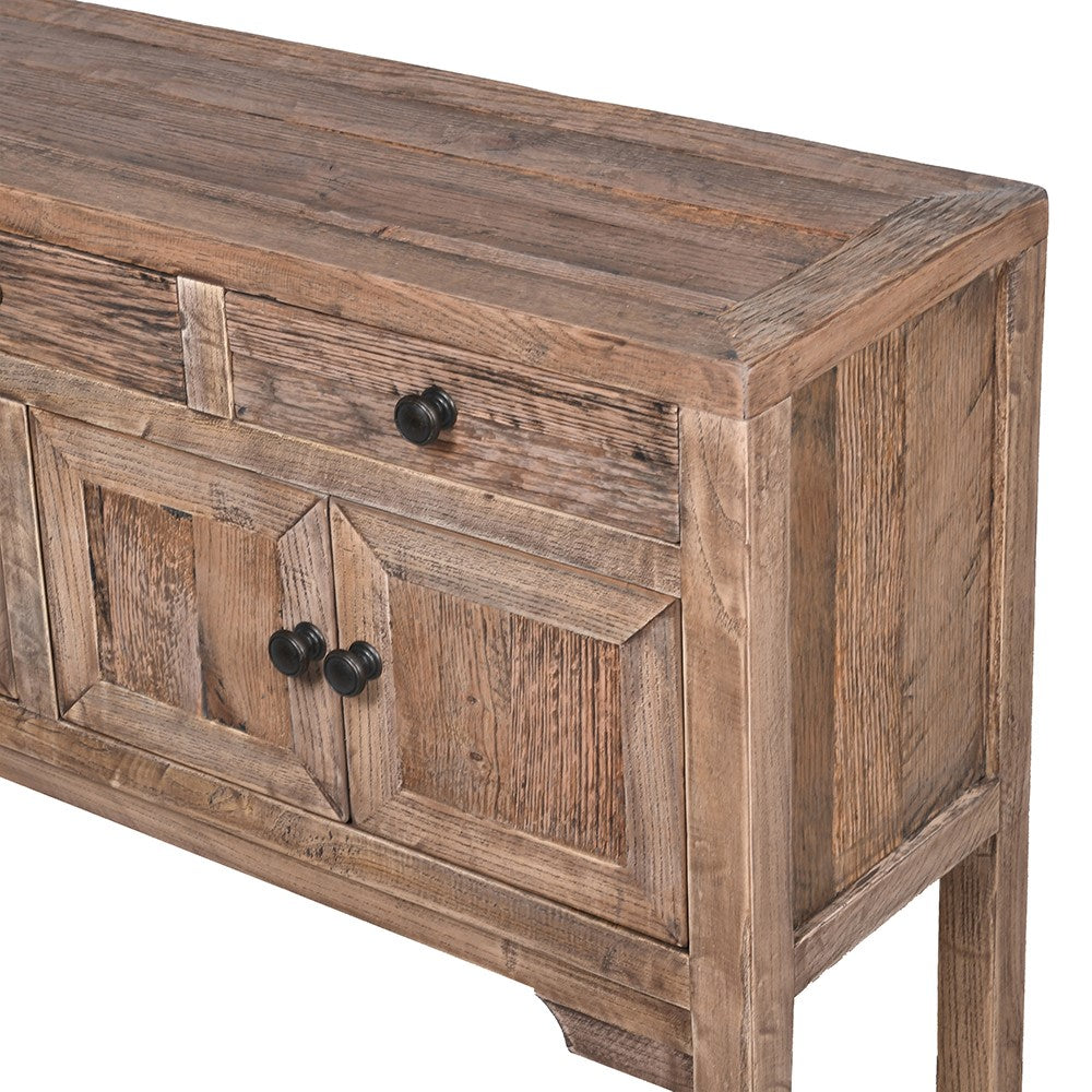 Close up of reclaimed wooden console table with drawers.