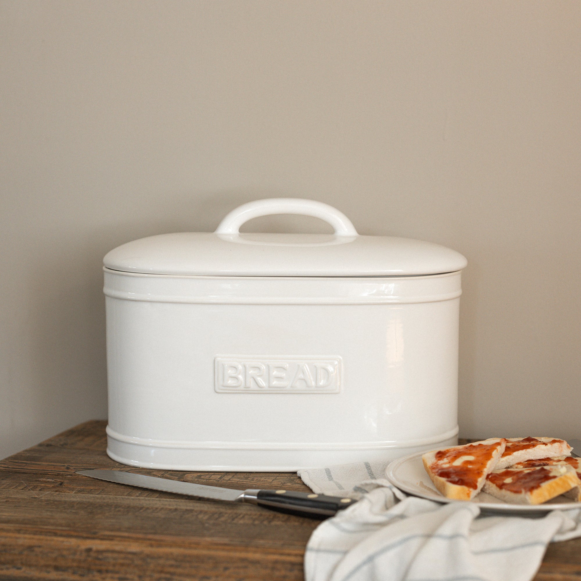 Rye_Ceramic_Bread_Box on wooden table with jammy bread.