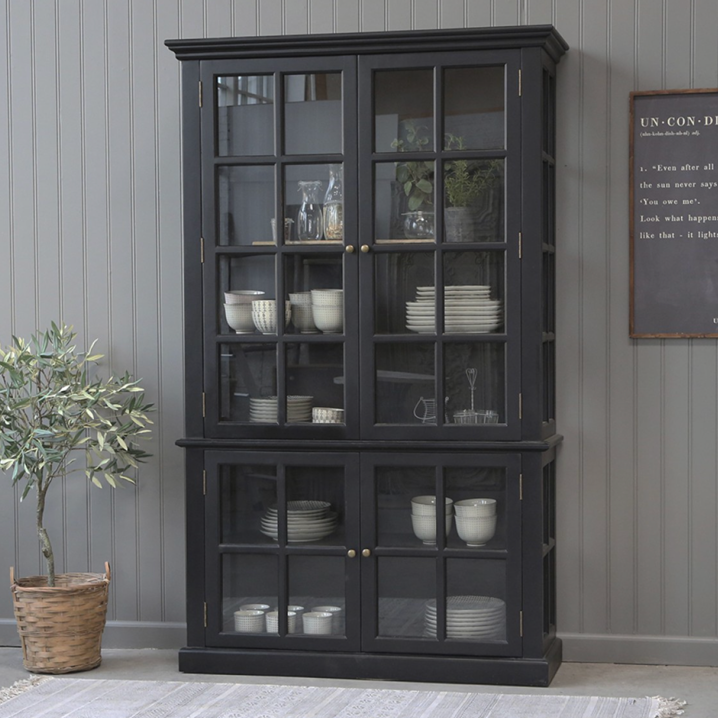 Black Armoire displaying crockery.