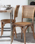 wicker dining chairs at table.